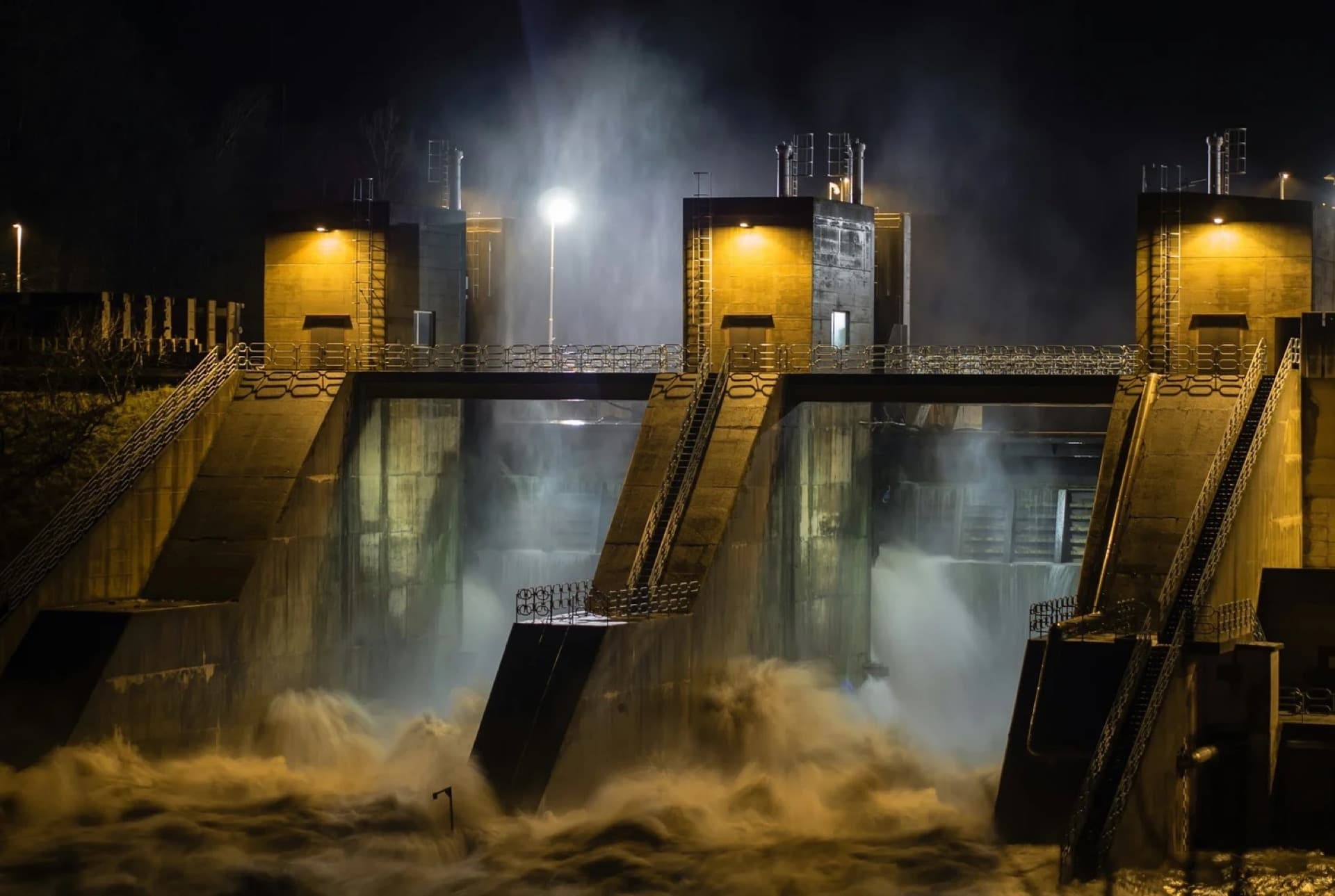 Dam spillway illuminated at night