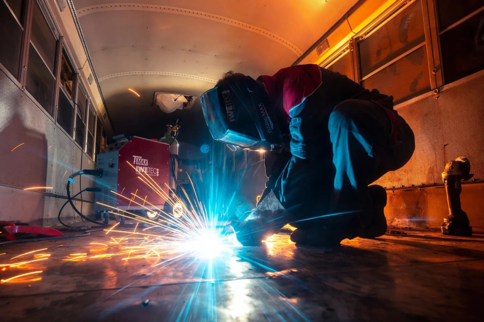 Welder working with sparks flying