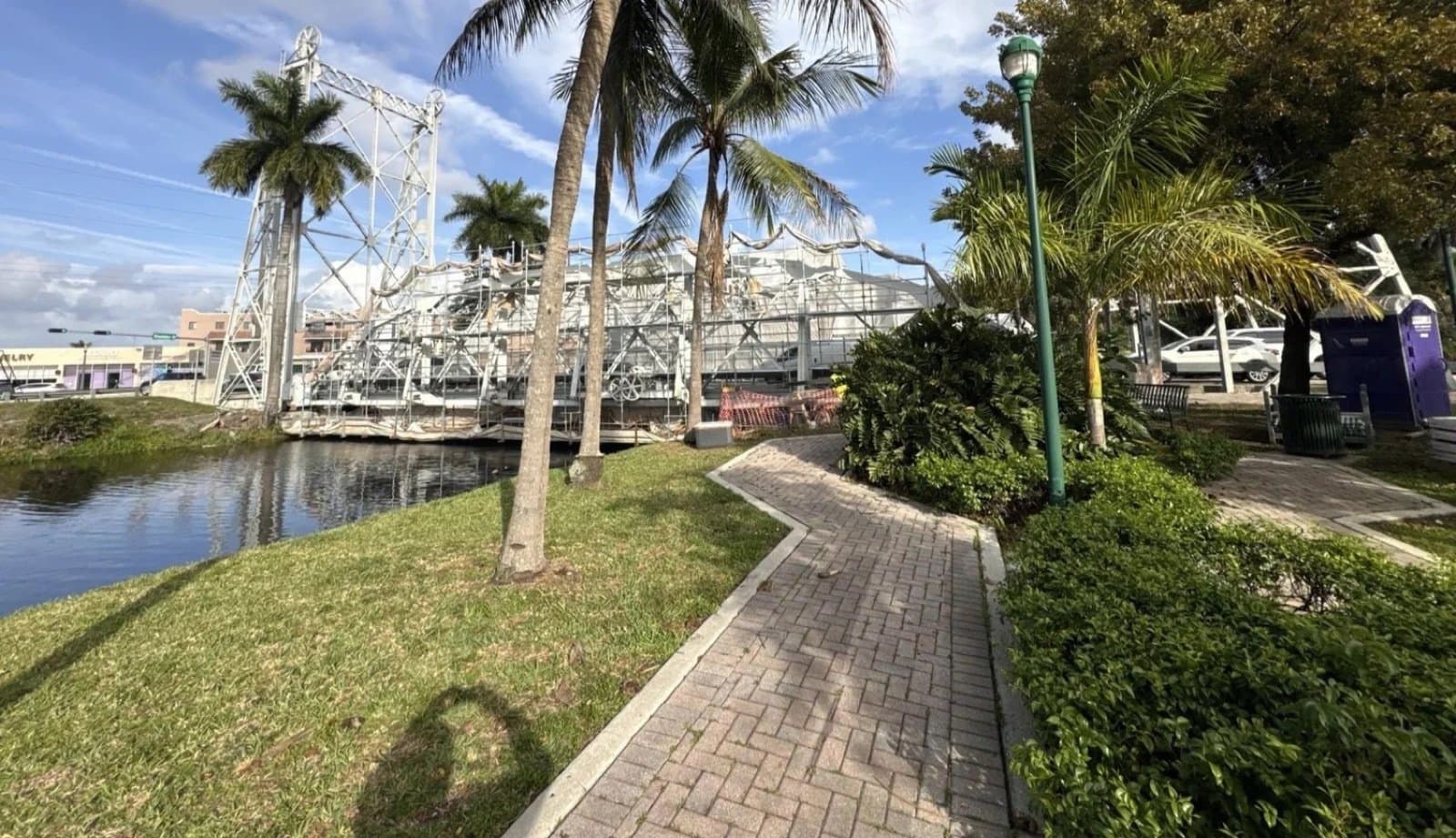 The lift bridge seen from the riverwalk under palms
